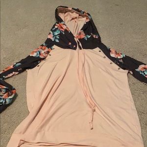 Pink hoodie with floral patterned sleeves and hood